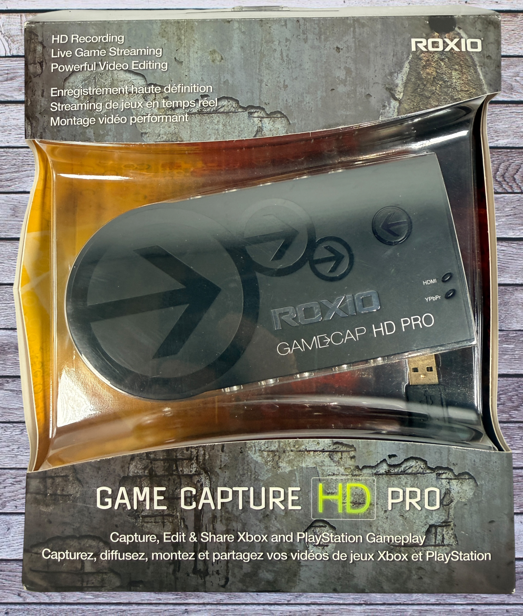 Capture Xbox and PlayStation gameplay with the Roxio Game Capture HD Pro. Includes original box, USB cable, HDMI support, and HD recording capability.