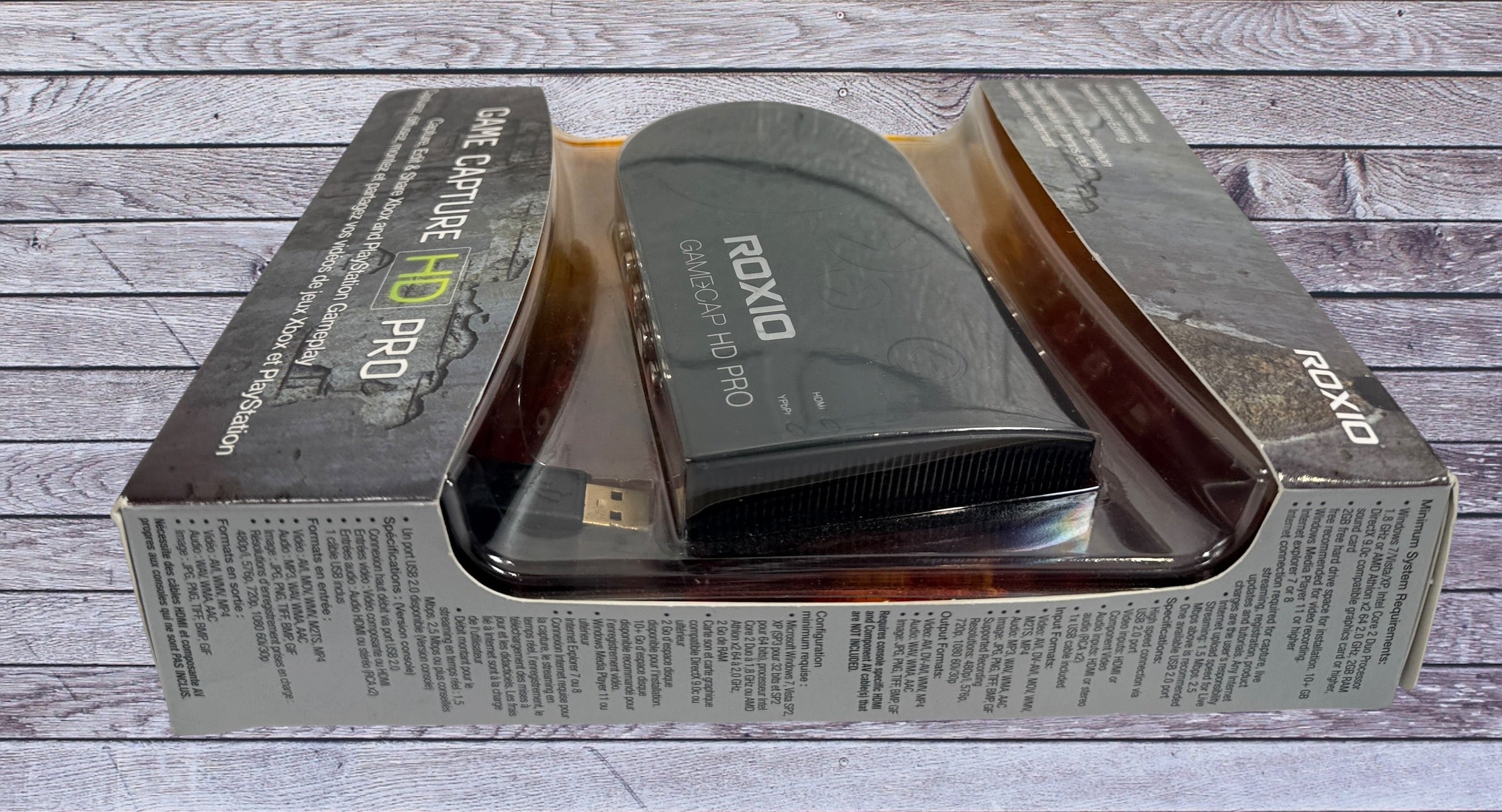 Capture Xbox and PlayStation gameplay with the Roxio Game Capture HD Pro. Includes original box, USB cable, HDMI support, and HD recording capability.