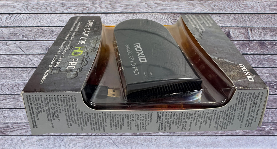 Capture Xbox and PlayStation gameplay with the Roxio Game Capture HD Pro. Includes original box, USB cable, HDMI support, and HD recording capability.