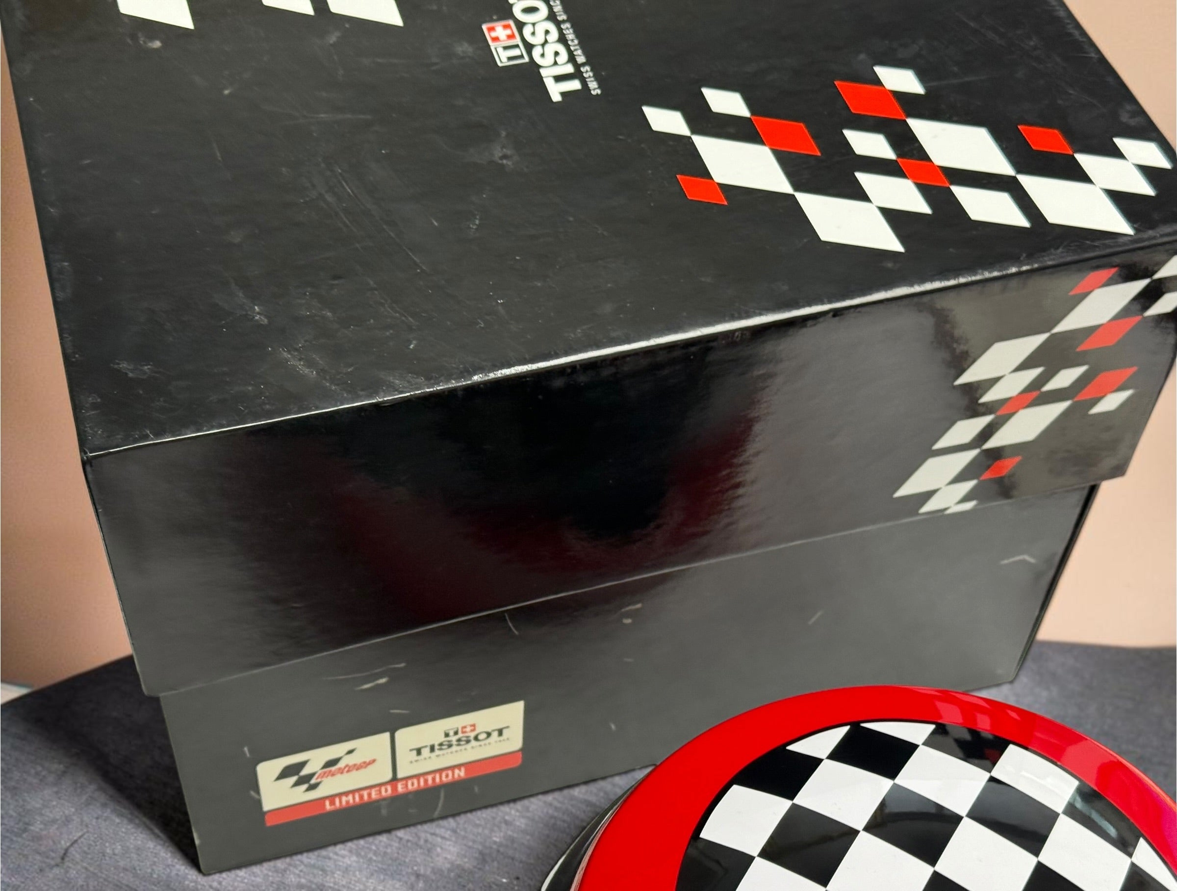 Rare Tissot T-Race MotoGP 2007 Limited Edition chronograph No. 1700/7002 with original helmet case, manuals, warranty card, and circuit medallions. Complete collector set.