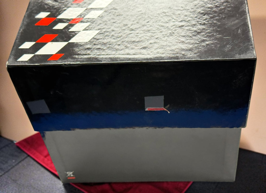 Rare Tissot T-Race MotoGP 2007 Limited Edition chronograph No. 1700/7002 with original helmet case, manuals, warranty card, and circuit medallions. Complete collector set.