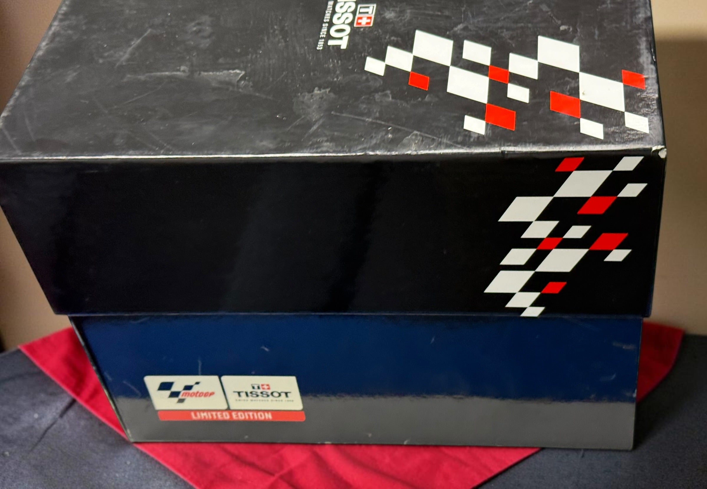 Rare Tissot T-Race MotoGP 2007 Limited Edition chronograph No. 1700/7002 with original helmet case, manuals, warranty card, and circuit medallions. Complete collector set.