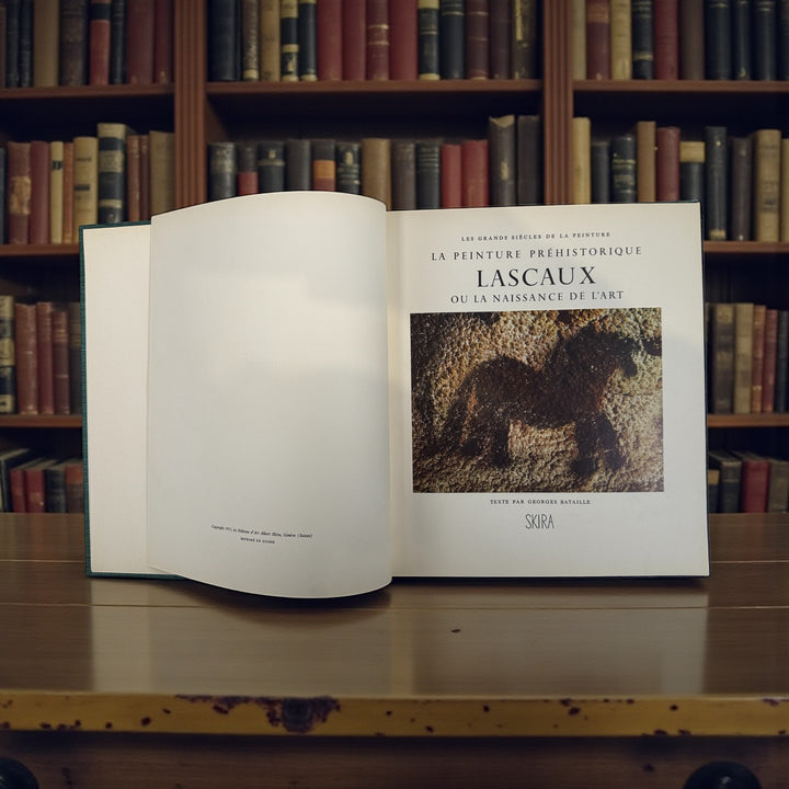 1955 Skira Lascaux art book by Georges Bataille with original slipcase and tipped-in plates. A collectible mid-century edition in excellent condition.