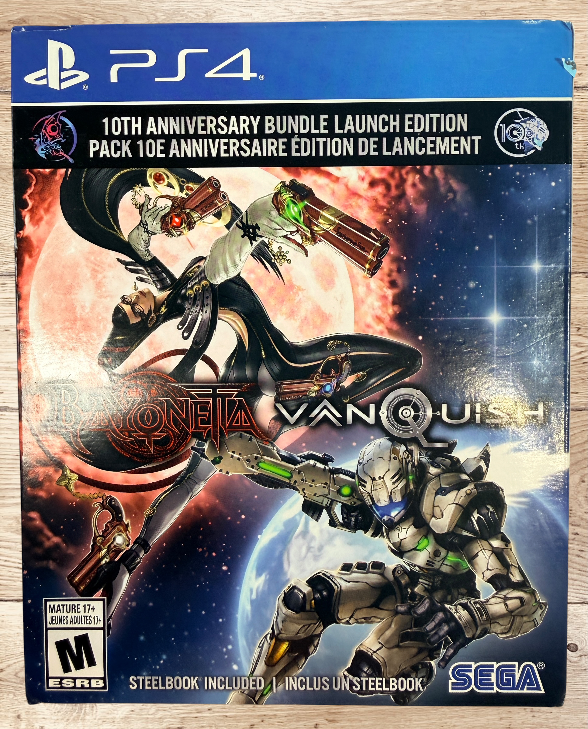 Complete PS4 Bayonetta &amp; Vanquish 10th Anniversary Launch Edition with exclusive SteelBook, slipbox, and game disc. Tested and ready to play.