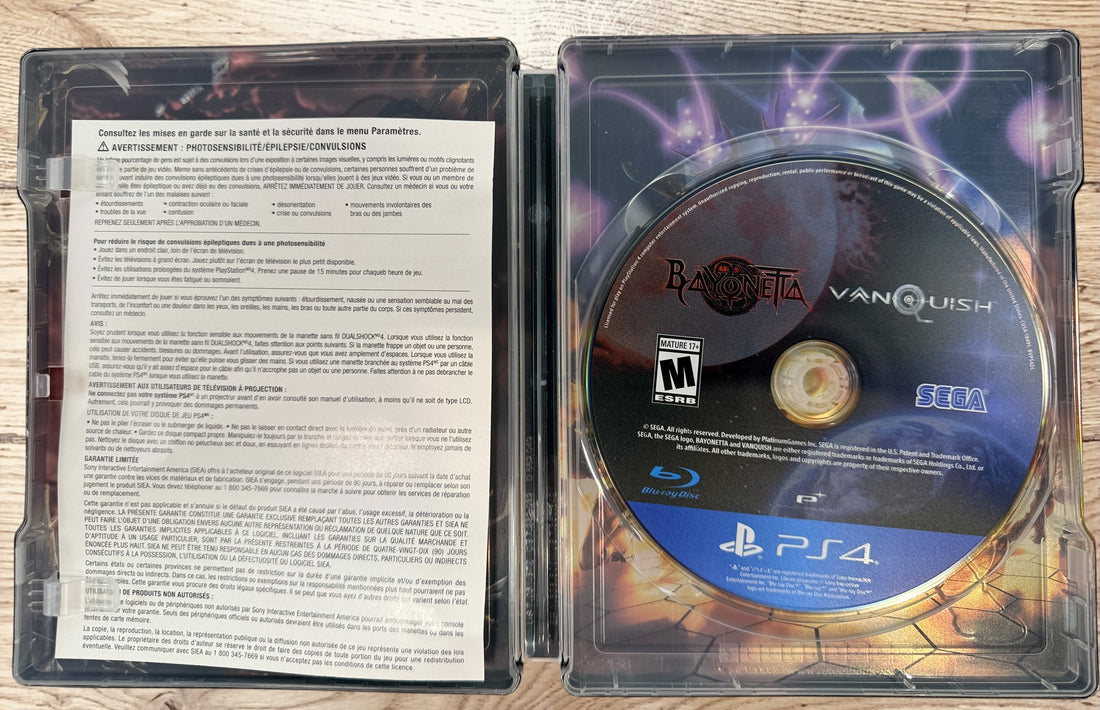 Complete PS4 Bayonetta &amp; Vanquish 10th Anniversary Launch Edition with exclusive SteelBook, slipbox, and game disc. Tested and ready to play.