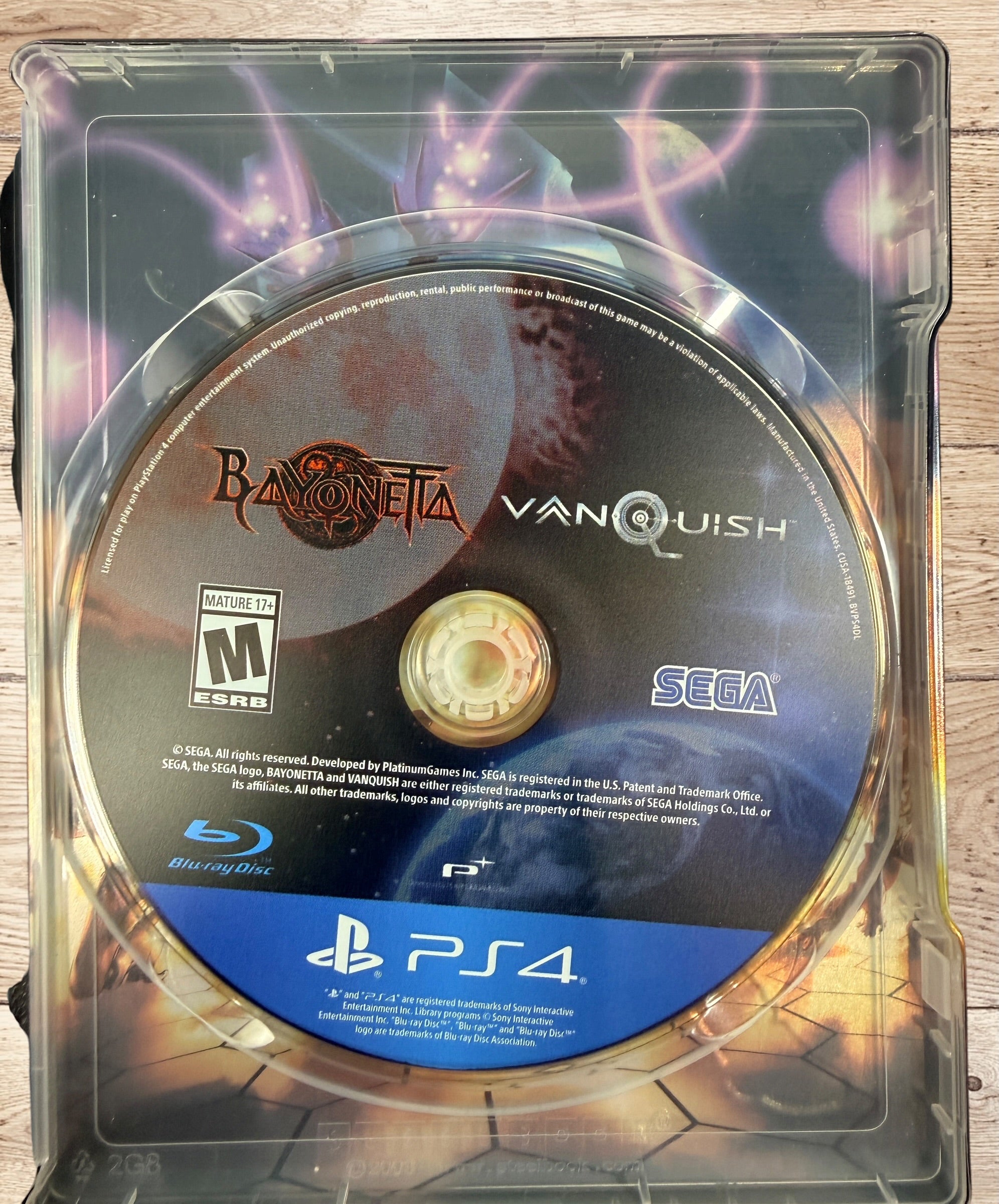 Complete PS4 Bayonetta &amp; Vanquish 10th Anniversary Launch Edition with exclusive SteelBook, slipbox, and game disc. Tested and ready to play.