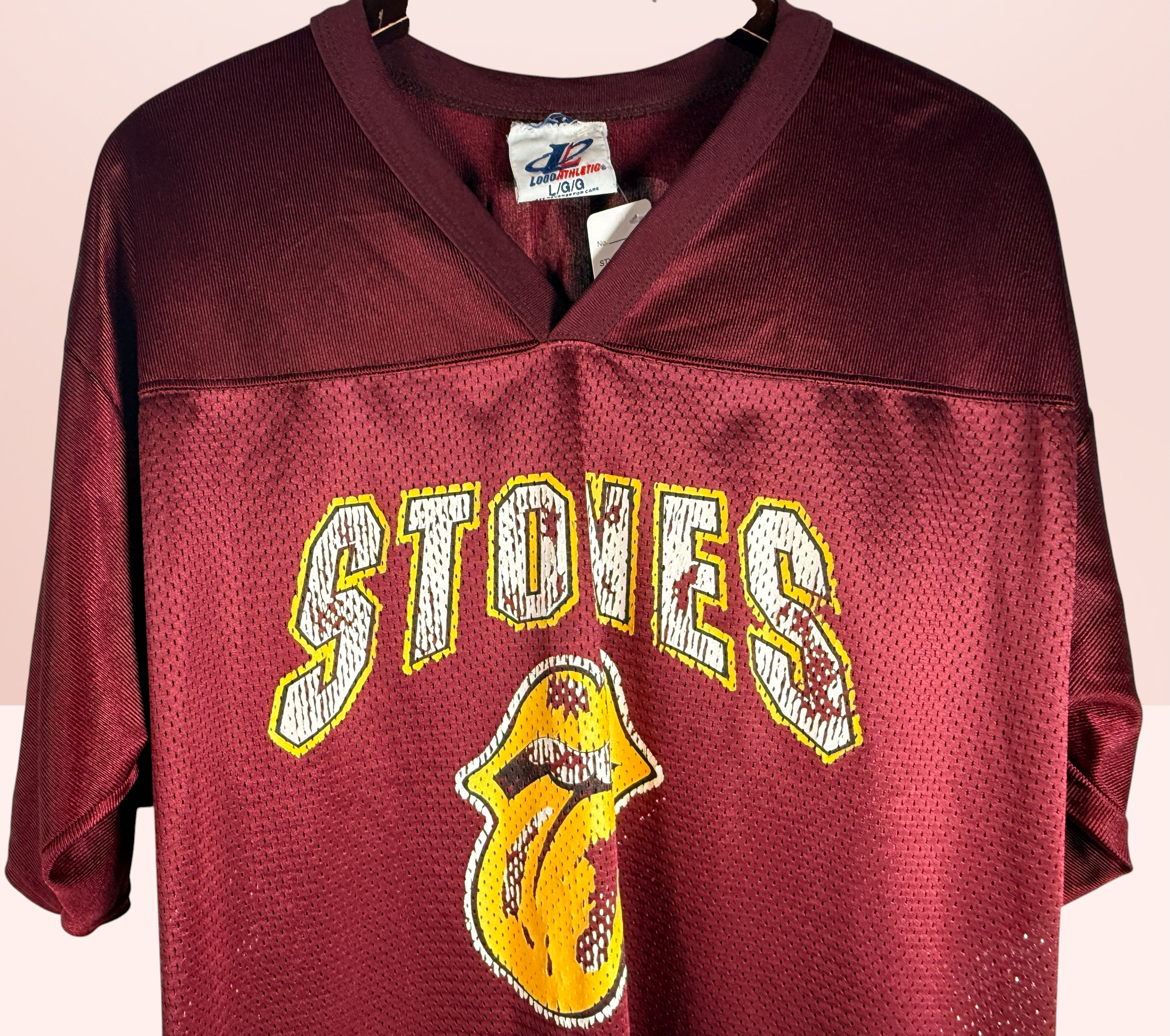 Authentic vintage Rolling Stones 98 football jersey by LogoAthletic. Official licensed USA-made burgundy mesh shirt with classic tongue logo and oversized 90s fit.