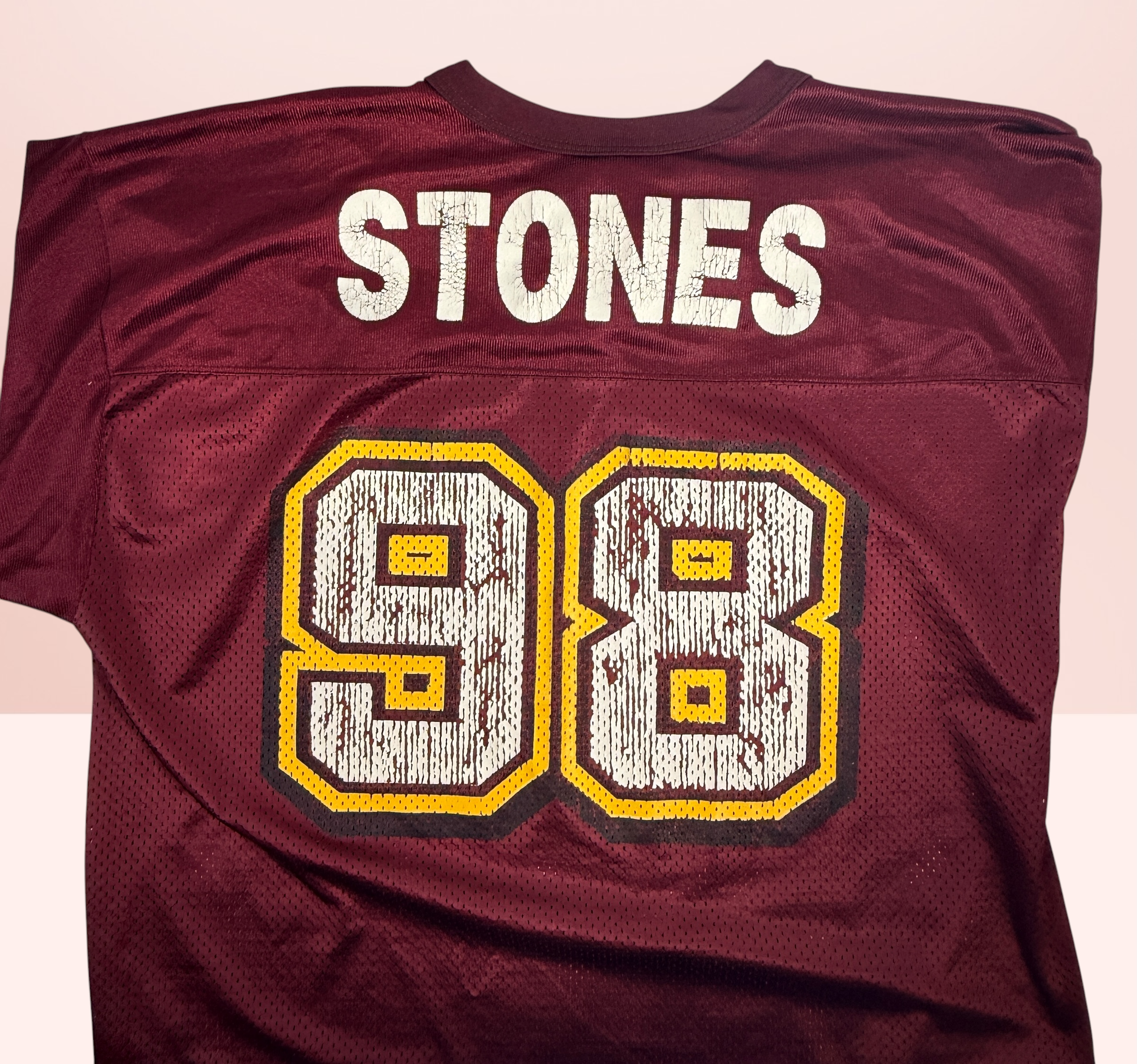 Authentic vintage Rolling Stones 98 football jersey by LogoAthletic. Official licensed USA-made burgundy mesh shirt with classic tongue logo and oversized 90s fit.