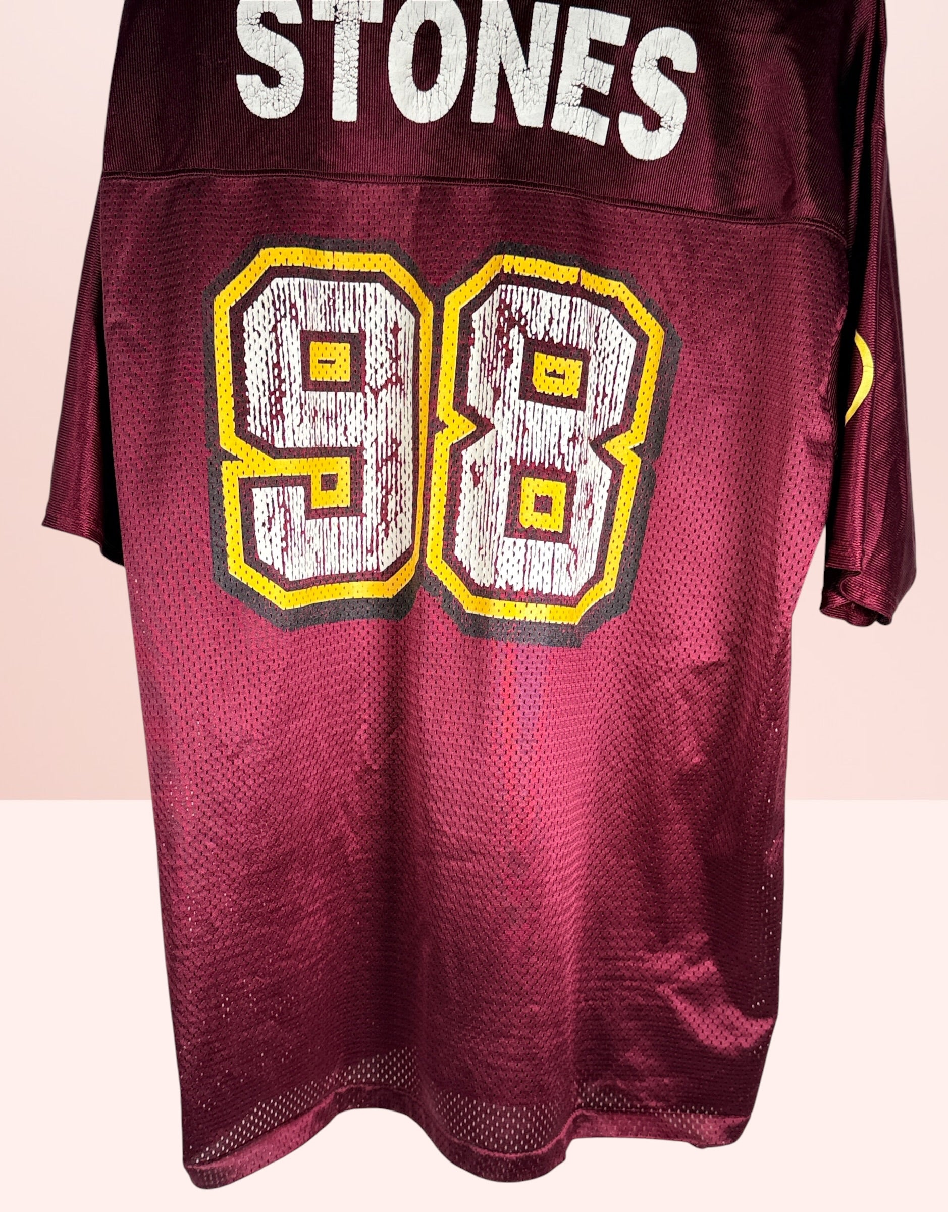 Authentic vintage Rolling Stones 98 football jersey by LogoAthletic. Official licensed USA-made burgundy mesh shirt with classic tongue logo and oversized 90s fit.