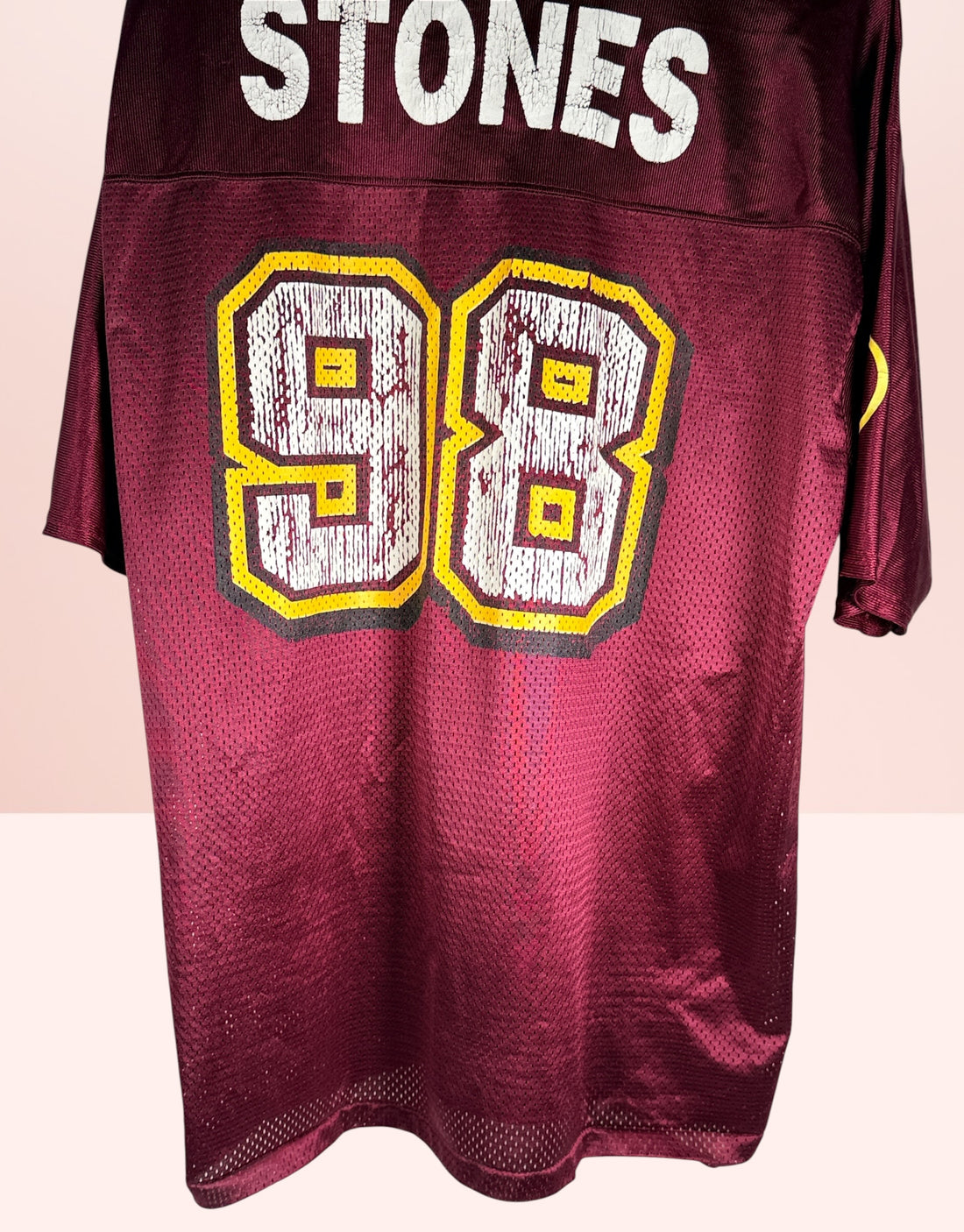 Authentic vintage Rolling Stones 98 football jersey by LogoAthletic. Official licensed USA-made burgundy mesh shirt with classic tongue logo and oversized 90s fit.