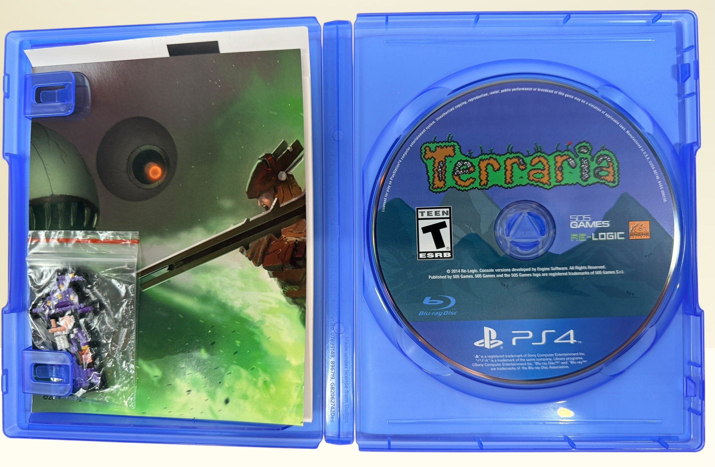 Terraria Special Edition for PS4 with original case, manual, Heroic Art Card, Wizard patch, and tested game disc. A collectible edition in very good condition.