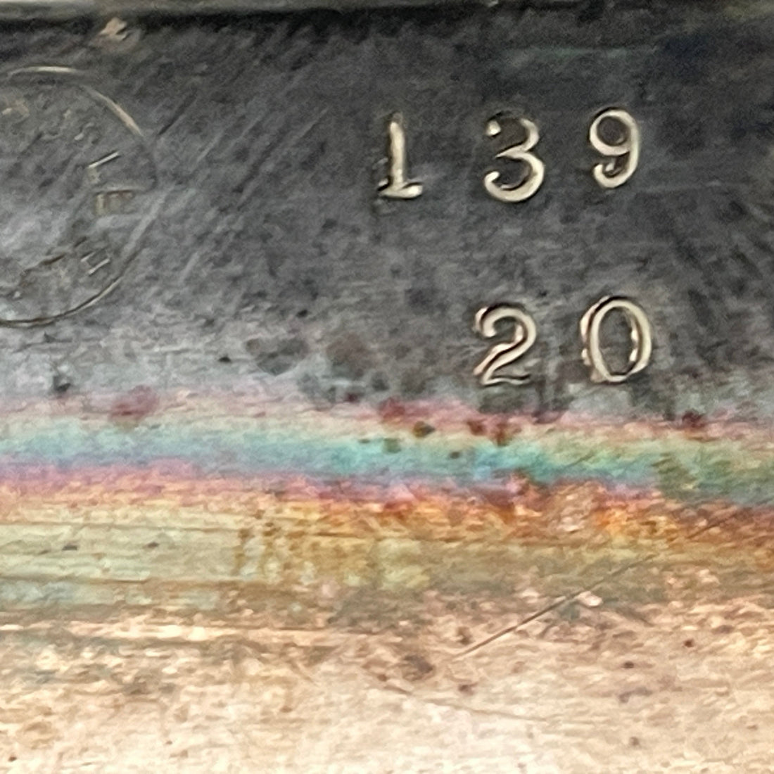 Metal surface with engraved numbers '139' and '20'