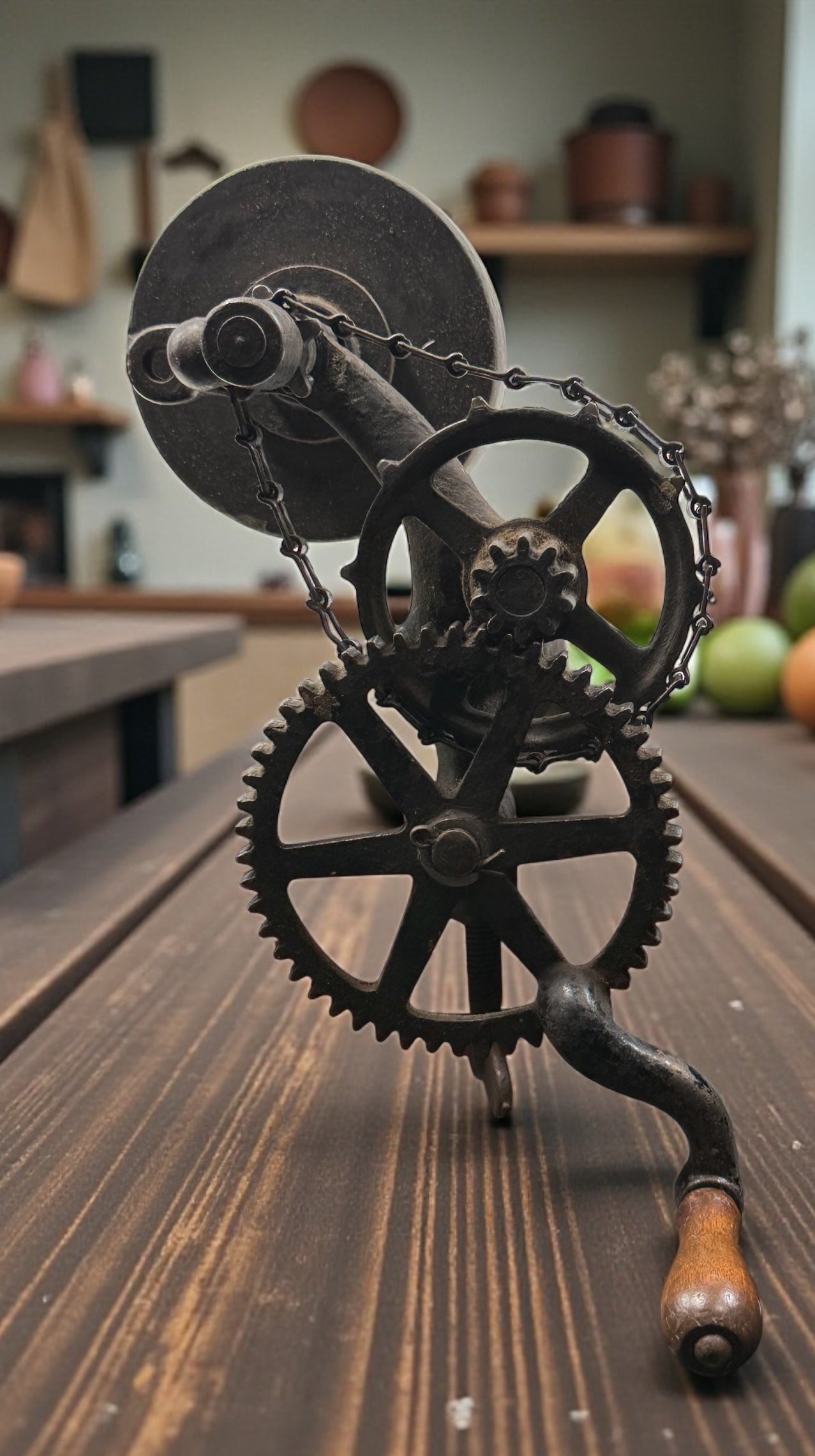 Working antique clamp-on cast-iron grinder with chain drive. Compact 19th-century sharpening tool, fully functional. Industrial décor or collector piece.