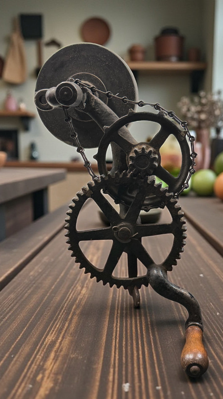 Working antique clamp-on cast-iron grinder with chain drive. Compact 19th-century sharpening tool, fully functional. Industrial décor or collector piece.