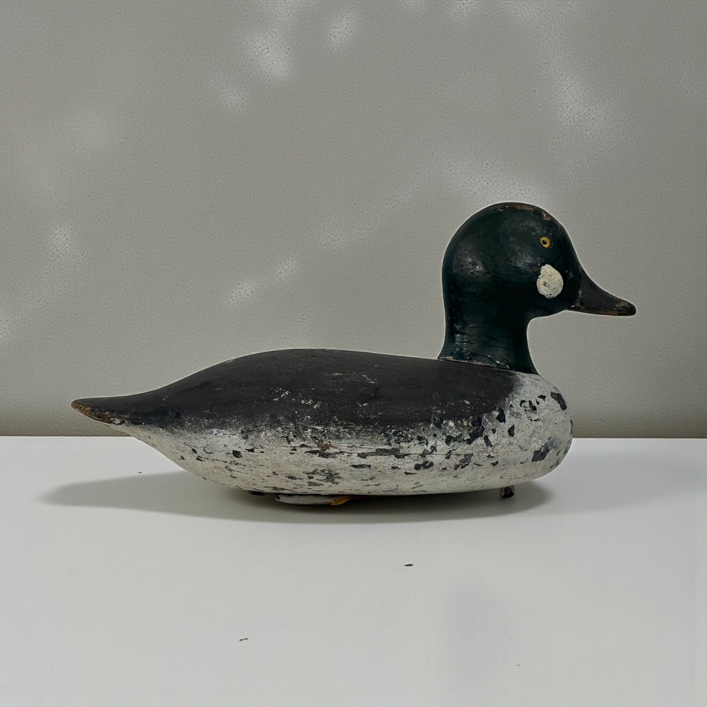 Vintage Quebec duck decoy attributed to Rivest of St-Sulpice. Hand-carved folk art with original ballast and authentic working wear. Collectible Canadian carving.