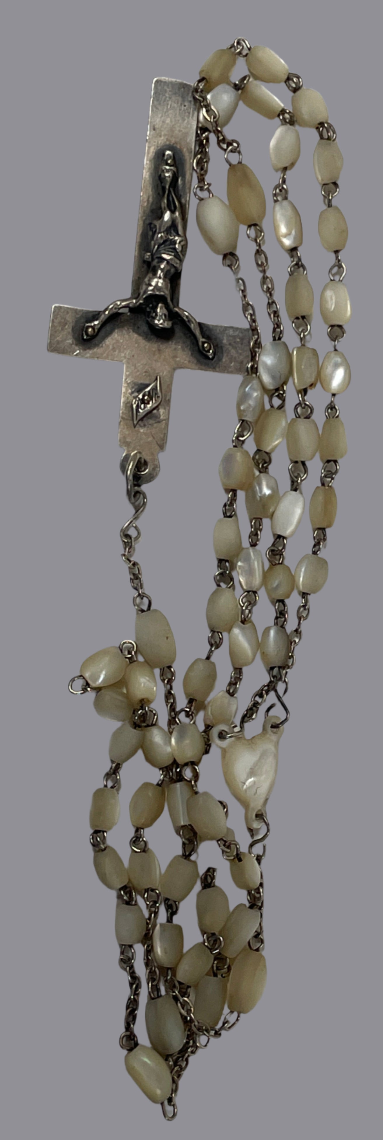 Necklace with beads and cross on a white background