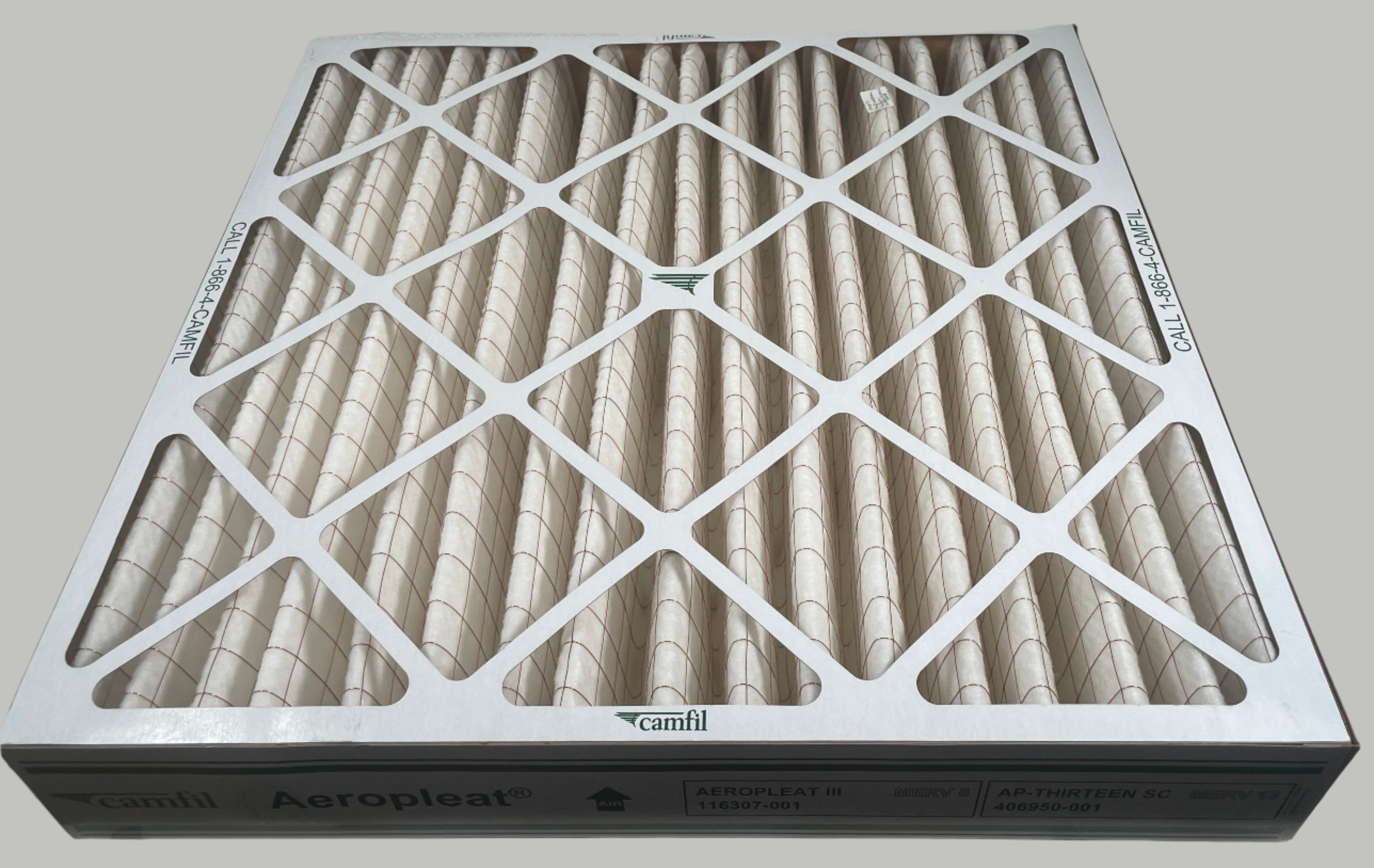 Air filter on a white surface with a tiled wall background