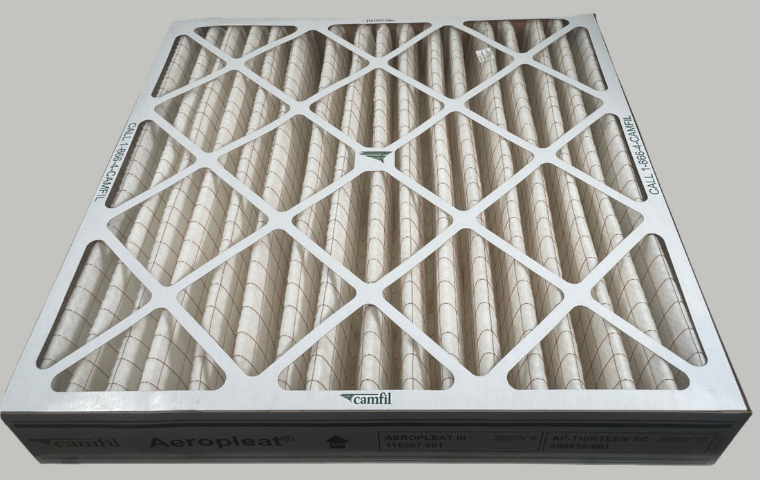 Air filter on a white surface with a tiled wall background