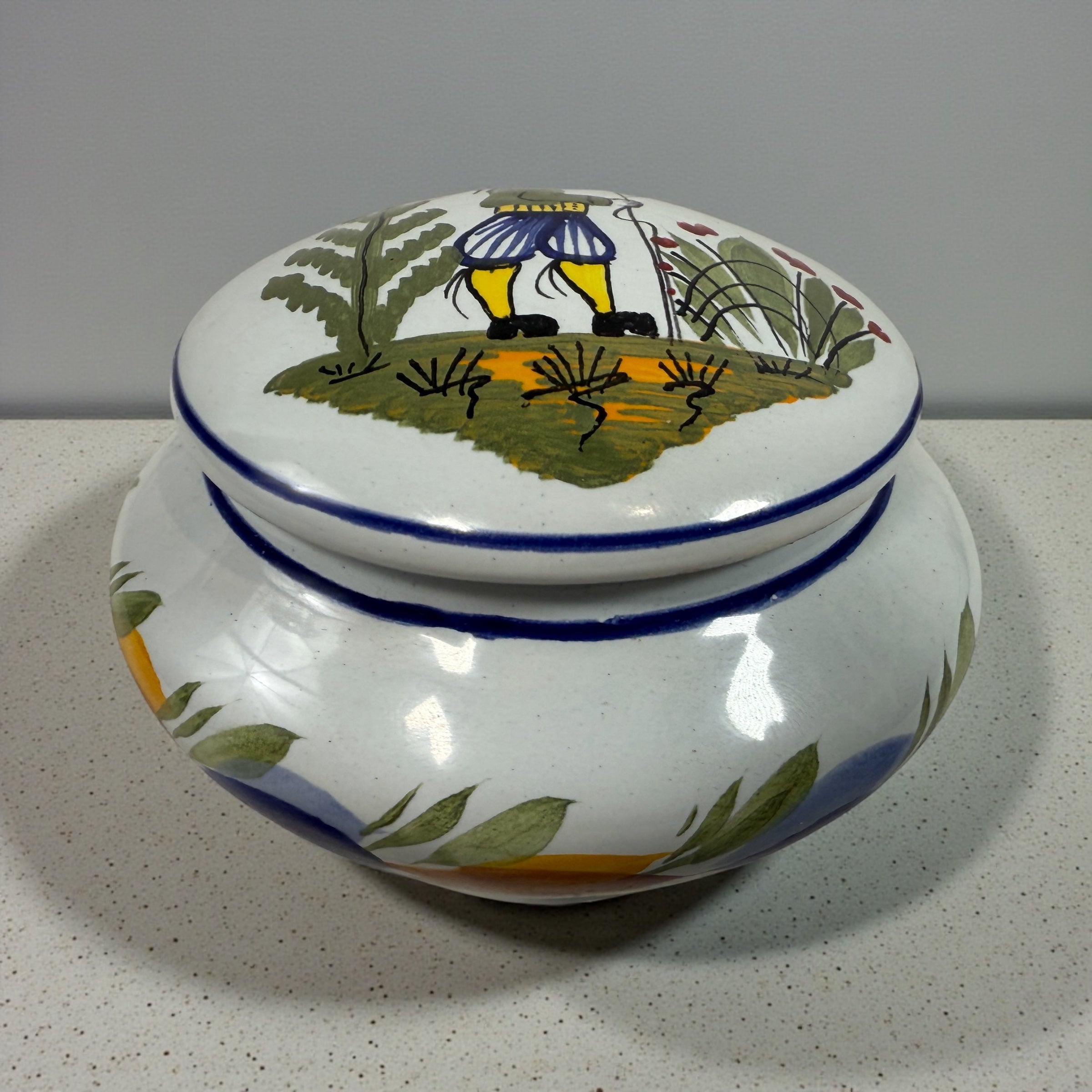 Hand-painted Henriot Quimper faience covered bowl with Breton figure lid, dated 2001. Studio-quality collectible in excellent condition. France-made ceramic.