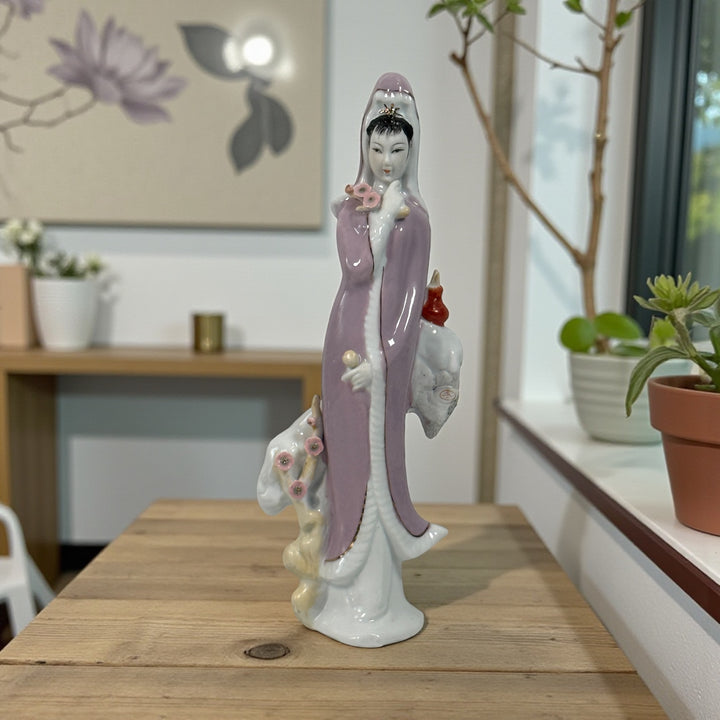 Vintage Chinese export Guanyin porcelain figurine with pastel lavender robe. Mid-century Buddhist decor, serene and elegant, in very good condition.