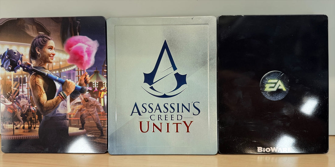 Lot of 3 collectible SteelBook cases: Assassin’s Creed Unity, Watch Dogs 2 and Dragon Age Inquisition. Empty cases only, no games included.