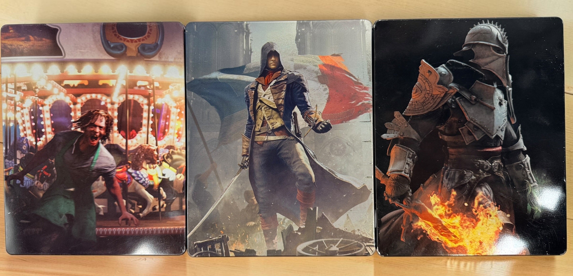 Lot of 3 collectible SteelBook cases: Assassin’s Creed Unity, Watch Dogs 2 and Dragon Age Inquisition. Empty cases only, no games included.