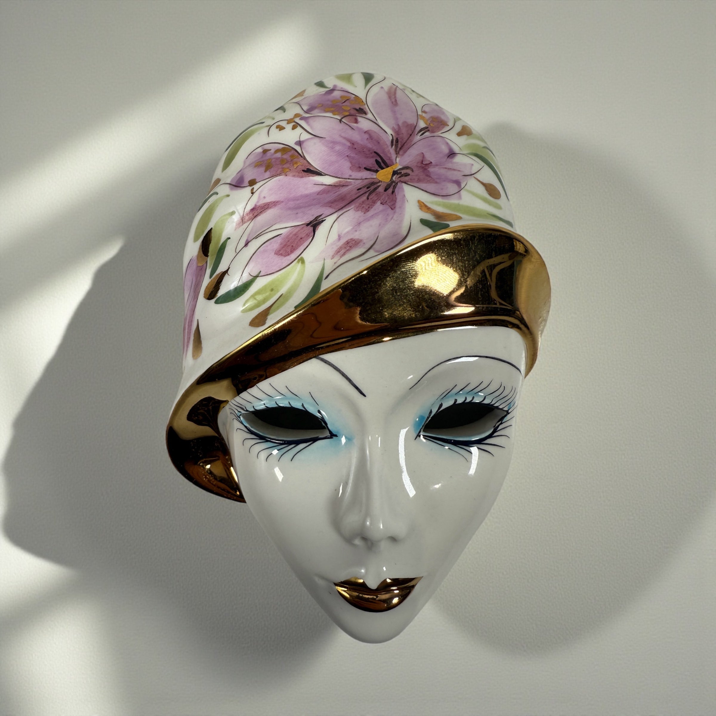 Vintage Italian Capodimonte porcelain wall mask with gold trim. Hand-painted decorative ceramic wall art made in Italy.