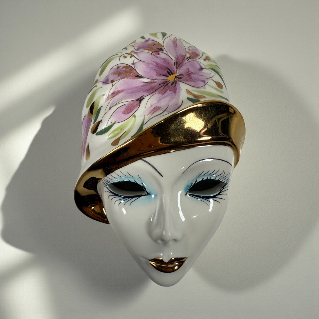 Vintage Italian Capodimonte porcelain wall mask with gold trim. Hand-painted decorative ceramic wall art made in Italy.