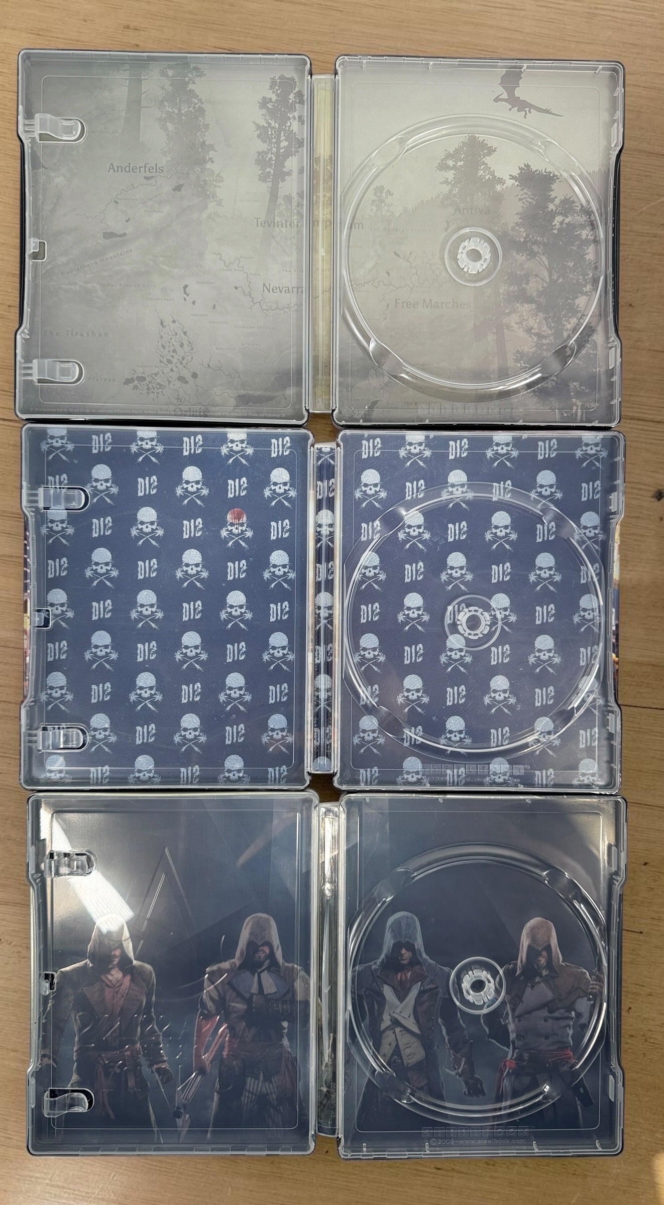 Lot of 3 collectible SteelBook cases: Assassin’s Creed Unity, Watch Dogs 2 and Dragon Age Inquisition. Empty cases only, no games included.