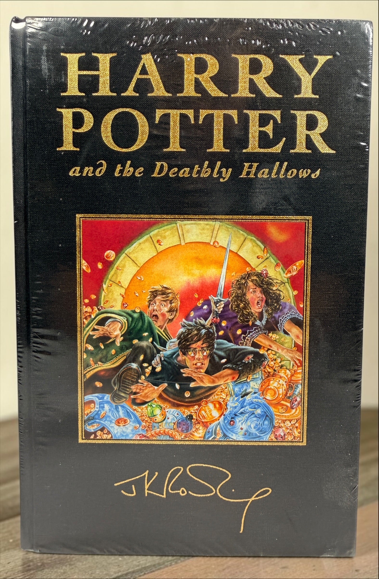 Harry Potter and the Deathly Hallows 2007 Bloomsbury Deluxe First Edition hardcover, factory sealed with gilt edges.