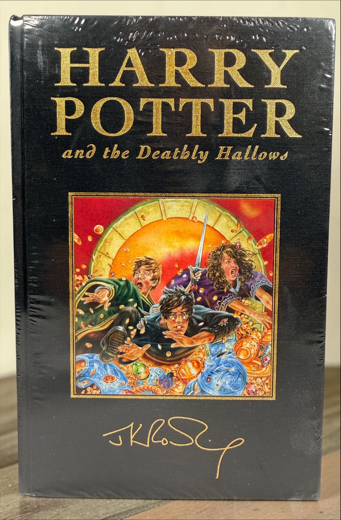 Harry Potter and the Deathly Hallows 2007 Bloomsbury Deluxe First Edition hardcover, factory sealed with gilt edges.