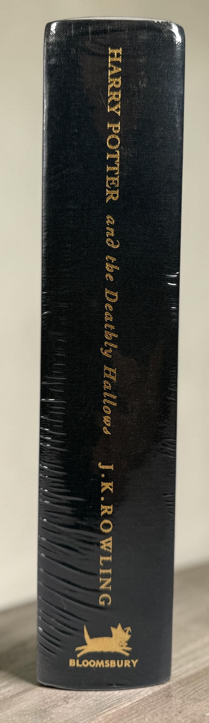 Harry Potter and the Deathly Hallows 2007 Bloomsbury Deluxe First Edition hardcover, factory sealed with gilt edges.