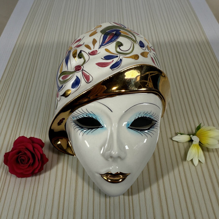 Vintage Italian ceramic wall mask from Modena with hand-painted floral design and gold accents. Authentic mid-century wall décor made in Italy.