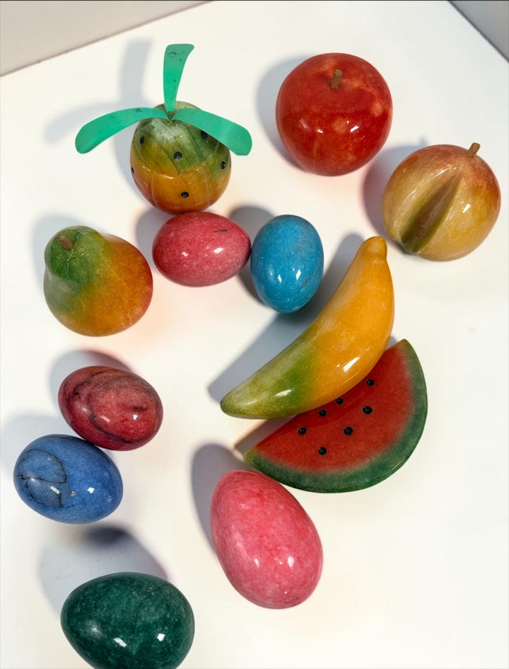 Vintage Italian hand-carved alabaster stone fruit and decorative eggs set. Lot of 12 polished pieces including apple, pear, banana, peach, pineapple, watermelon and colorful stone eggs.
