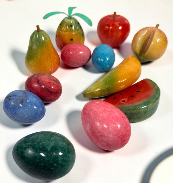Vintage Italian hand-carved alabaster stone fruit and decorative eggs set. Lot of 12 polished pieces including apple, pear, banana, peach, pineapple, watermelon and colorful stone eggs.