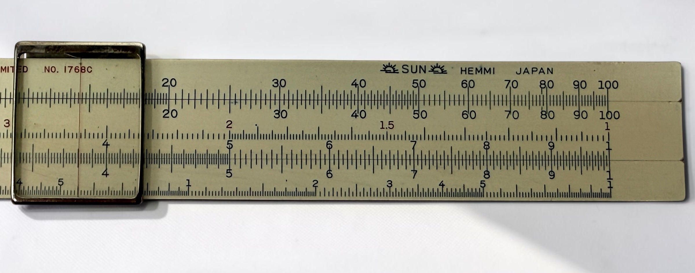 Vintage Hughes-Owens No. 1768C 10-inch slide rule made in Japan by Sun Hemmi. Mid-century bamboo engineering calculator with original case.