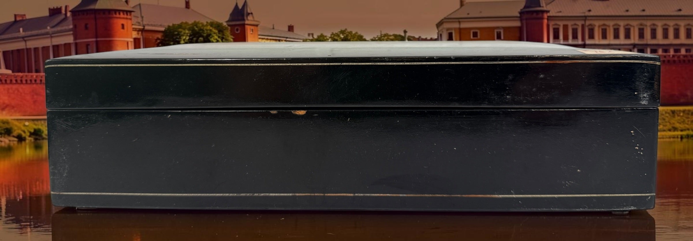 Vintage Russian lacquer decorative box featuring a historic Moscow Kremlin scene, black lacquer exterior and striking red interio