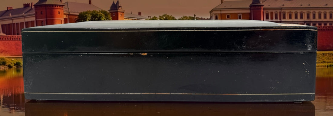 Vintage Russian lacquer decorative box featuring a historic Moscow Kremlin scene, black lacquer exterior and striking red interio