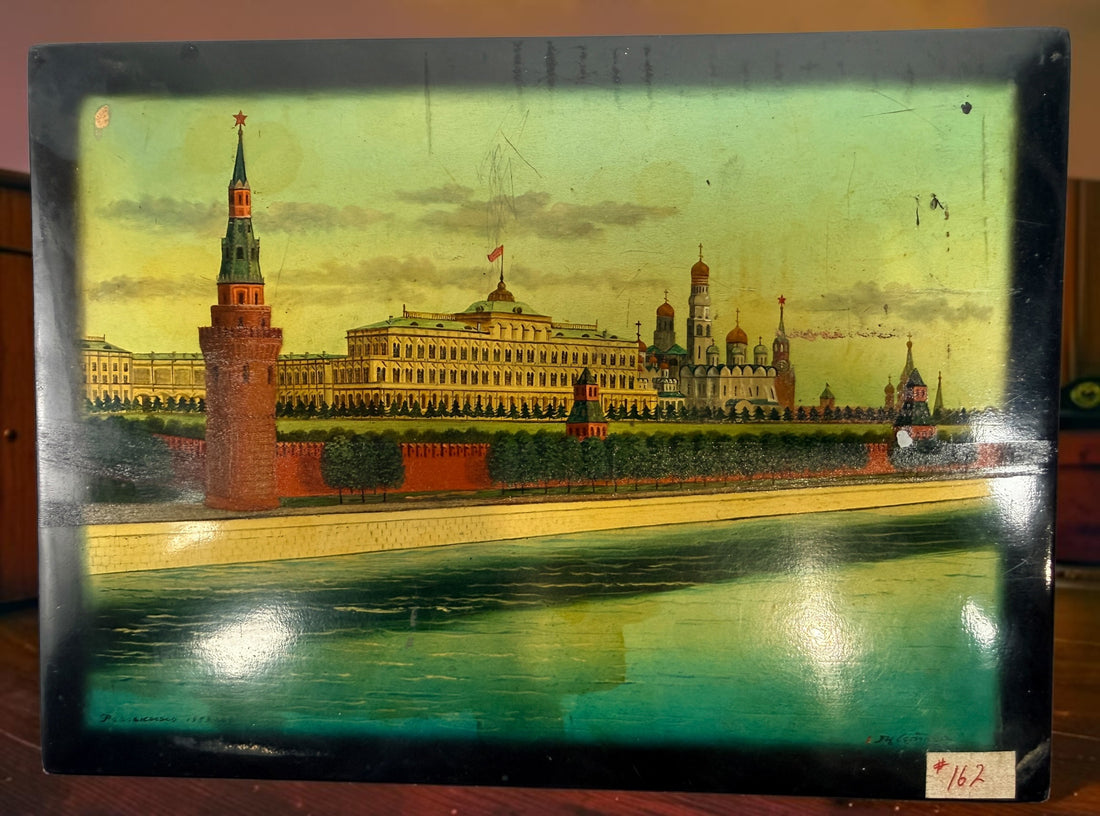 Vintage Russian lacquer decorative box featuring a historic Moscow Kremlin scene, black lacquer exterior and striking red interio
