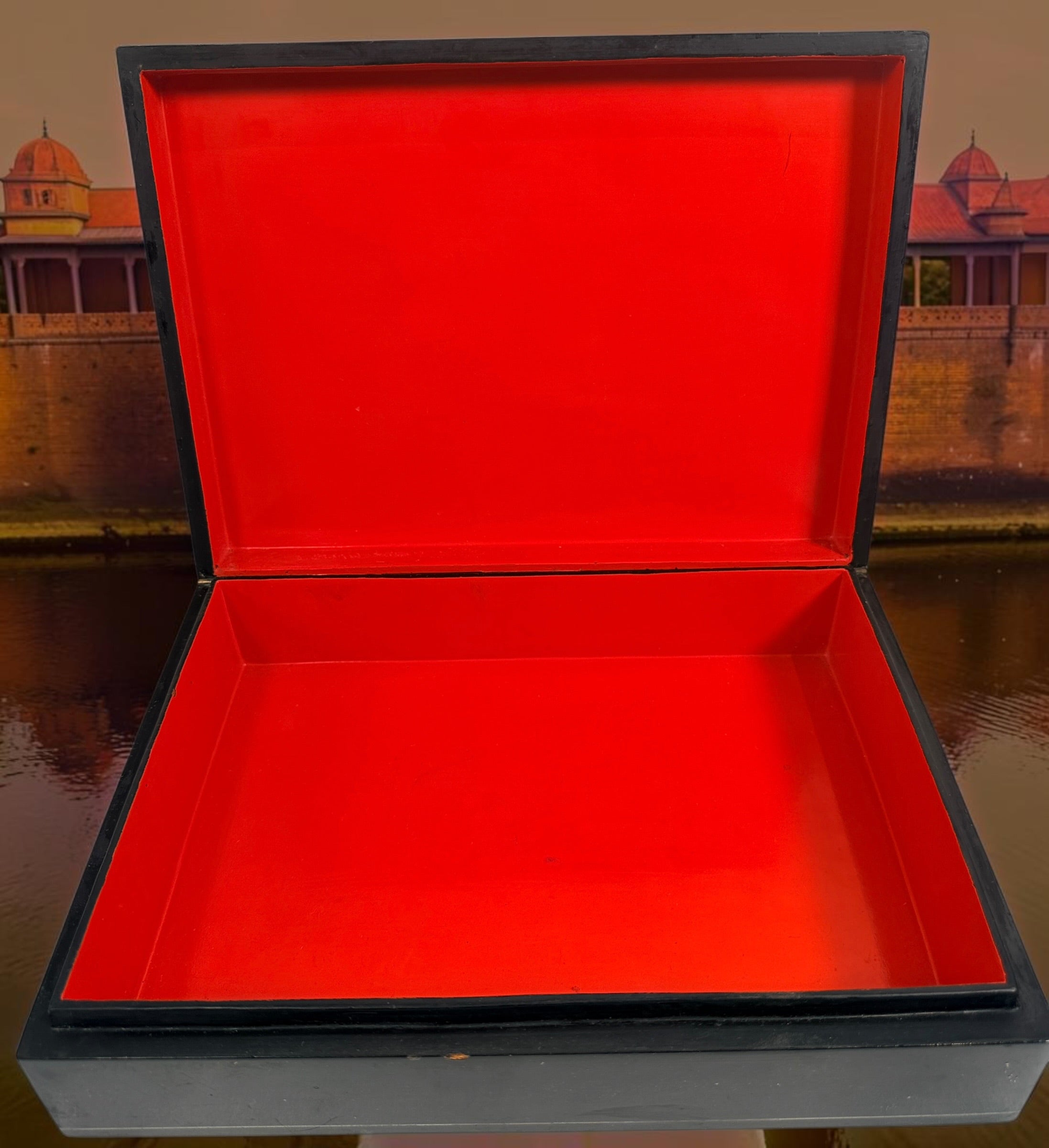 Vintage Russian lacquer decorative box featuring a historic Moscow Kremlin scene, black lacquer exterior and striking red interio