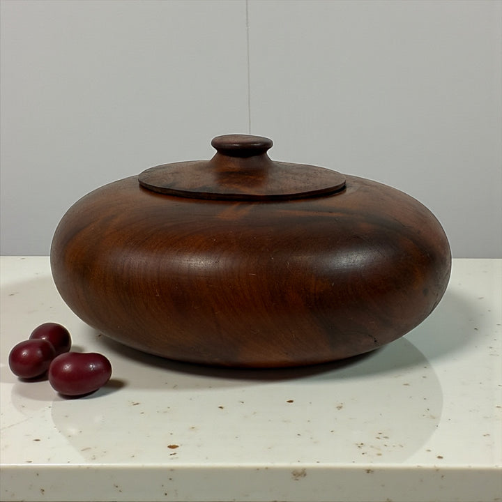 Vintage hand-turned walnut lidded bowl, small decorative trinket dish with natural wood grain, mid-century modern style decor accent.