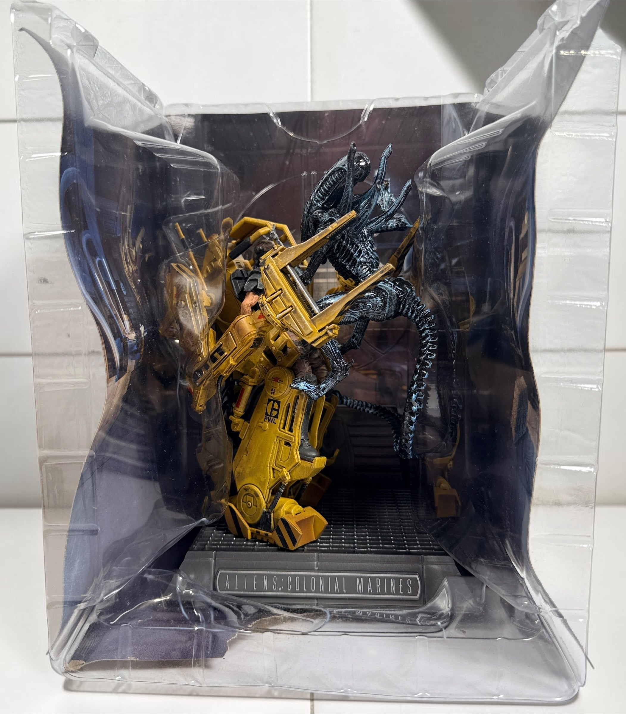 Aliens Colonial Marines Collector’s Edition for PS3 with Power Loader vs. Xenomorph statue, sealed USCM patches and original packaging. Water-damaged box.