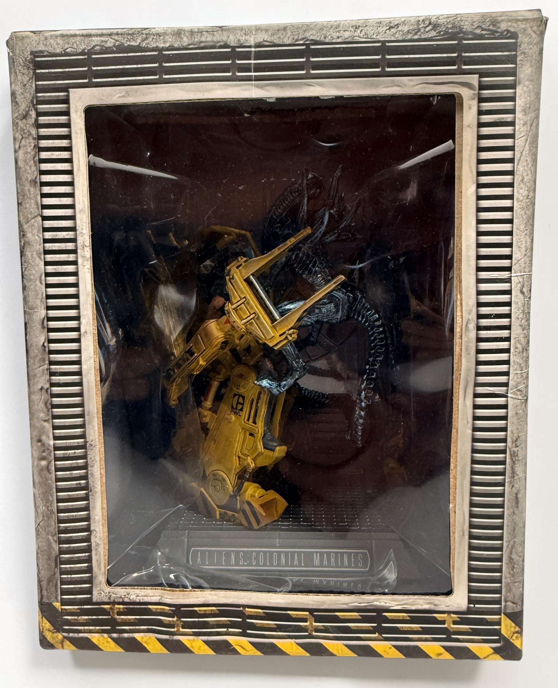 Aliens Colonial Marines Collector’s Edition for PS3 with Power Loader vs. Xenomorph statue, sealed USCM patches and original packaging. Water-damaged box.