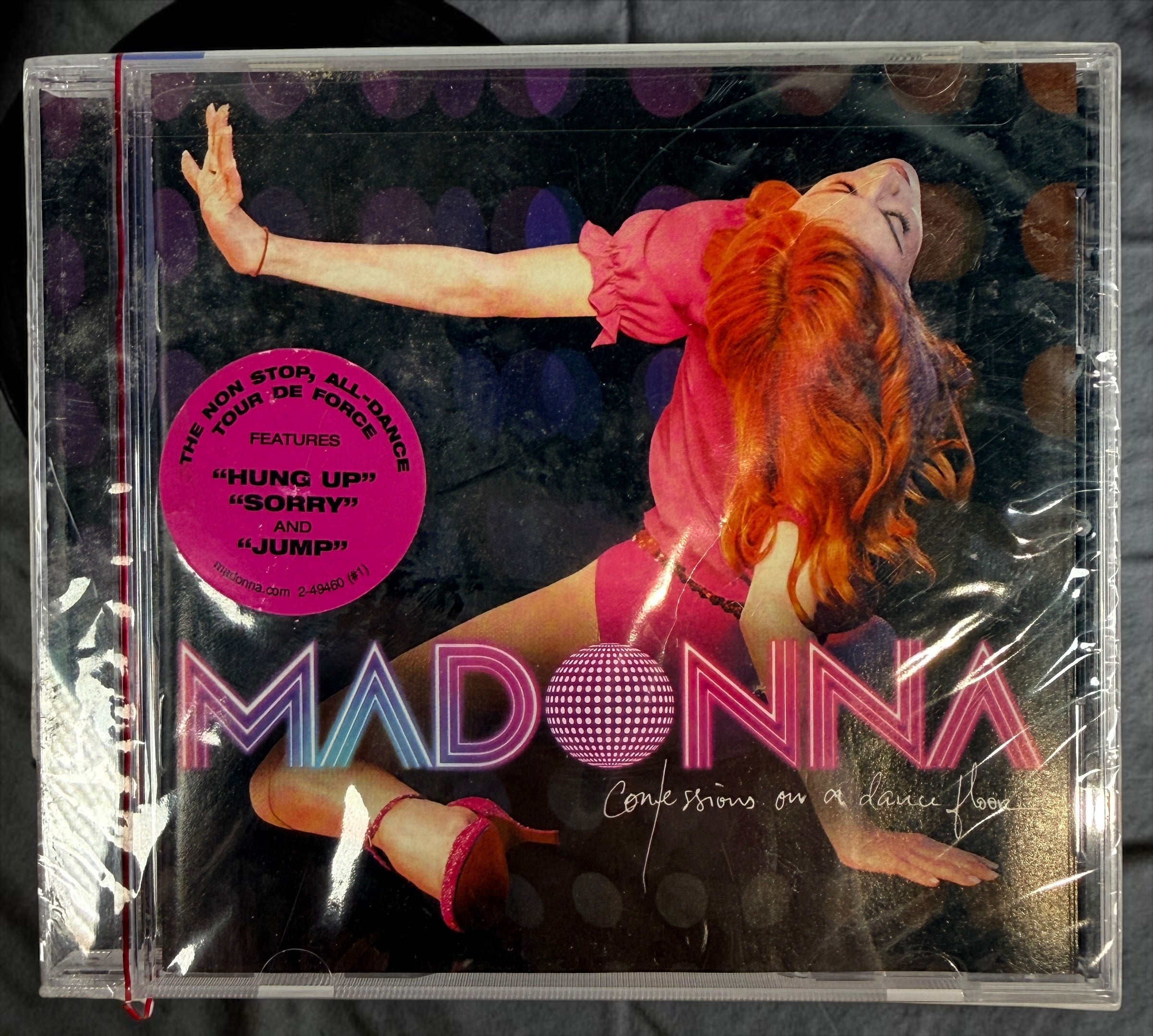 Factory-sealed 2005 Madonna Confessions on a Dance Floor CD featuring “Hung Up,” “Sorry,” and “Jump.” Original Warner Bros. release with hype sticker.