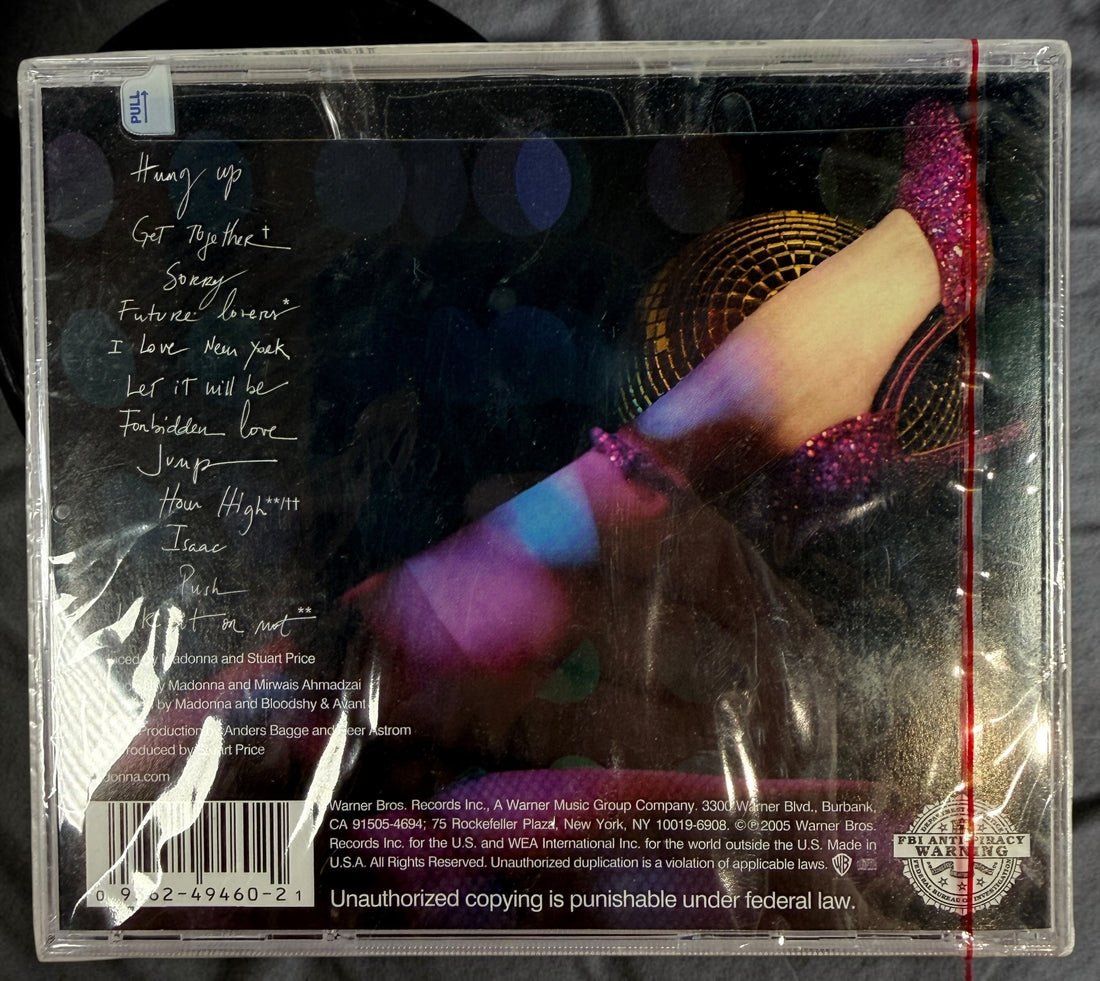 Factory-sealed 2005 Madonna Confessions on a Dance Floor CD featuring “Hung Up,” “Sorry,” and “Jump.” Original Warner Bros. release with hype sticker.