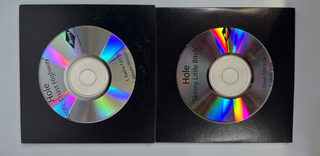 Official 2010 Hole Mercury Records promotional CD lot featuring Pacific Coast Highway and Skinny Little Bitch. Includes two original radio promo CDs in paper sleeves.