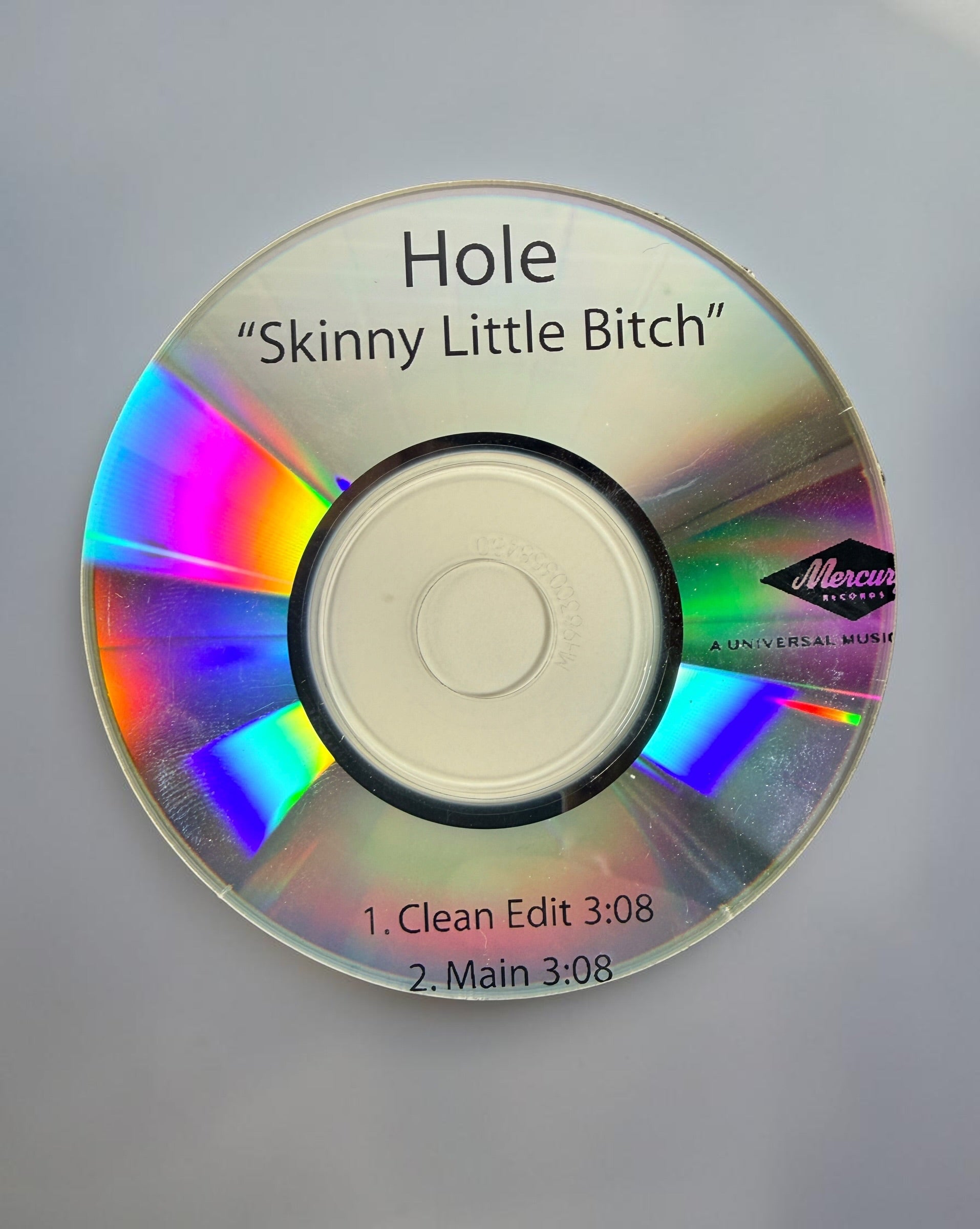 Official 2010 Hole Mercury Records promotional CD lot featuring Pacific Coast Highway and Skinny Little Bitch. Includes two original radio promo CDs in paper sleeves.