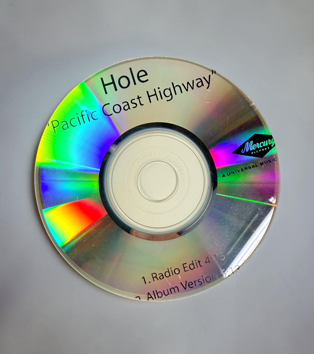 Official 2010 Hole Mercury Records promotional CD lot featuring Pacific Coast Highway and Skinny Little Bitch. Includes two original radio promo CDs in paper sleeves.