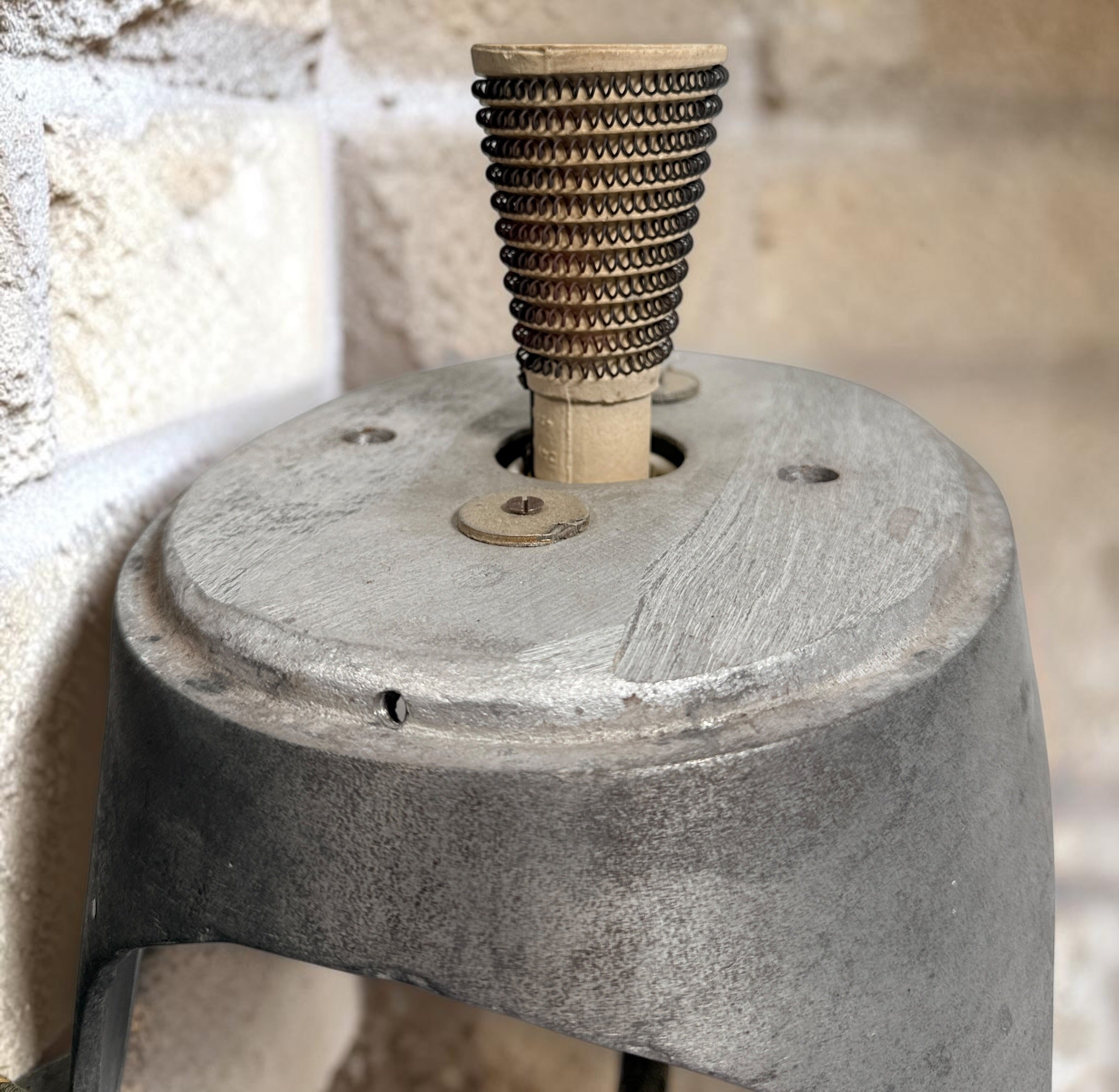 Working antique electric millinery hat block heater with cast aluminum housing and original ceramic heating element. Rare professional hat making equipment from the mid-20th century.