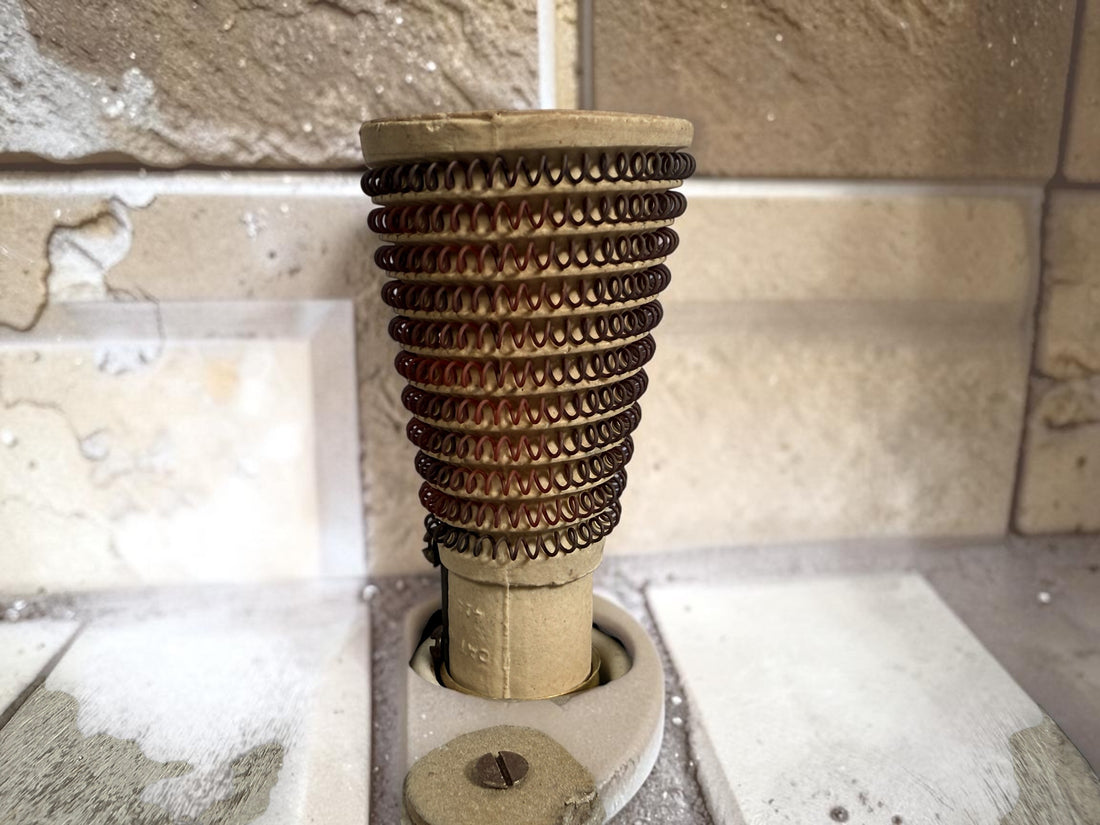 Working antique electric millinery hat block heater with cast aluminum housing and original ceramic heating element. Rare professional hat making equipment from the mid-20th century.